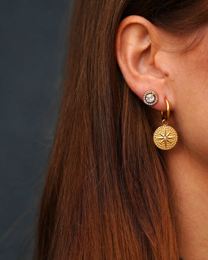 Gold-plated hoop earrings with compass medallion